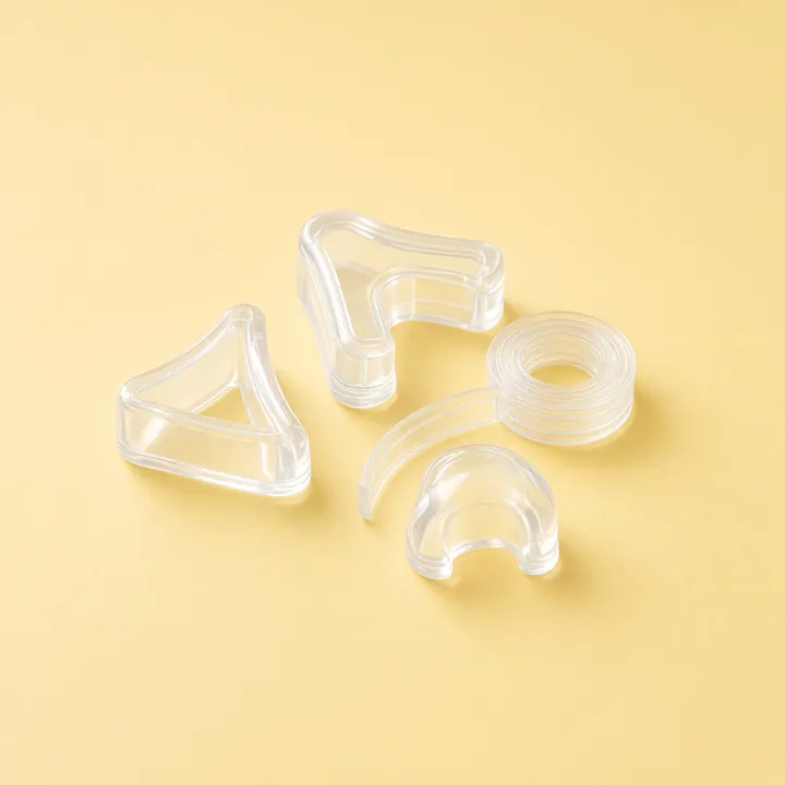 Clear silicone corner guards and a coil of edge strip