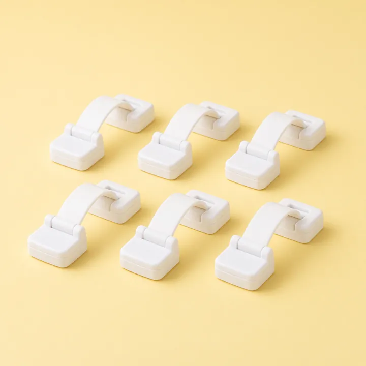 Six white adhesive drawer and appliance latches