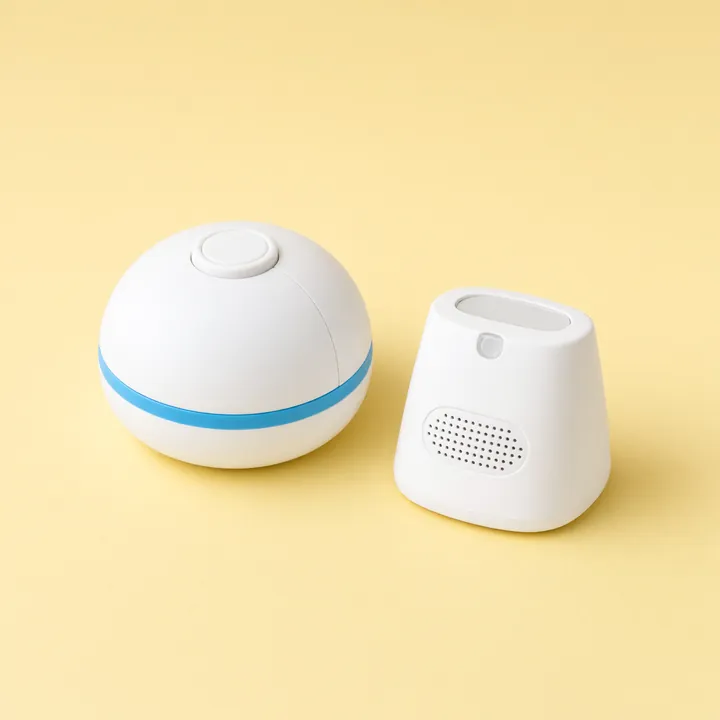 White round pool alarm sensor beside its indoor receiver