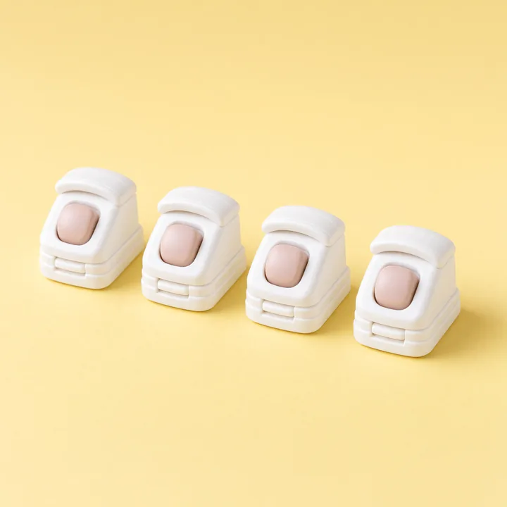 Four small white window stop locks
